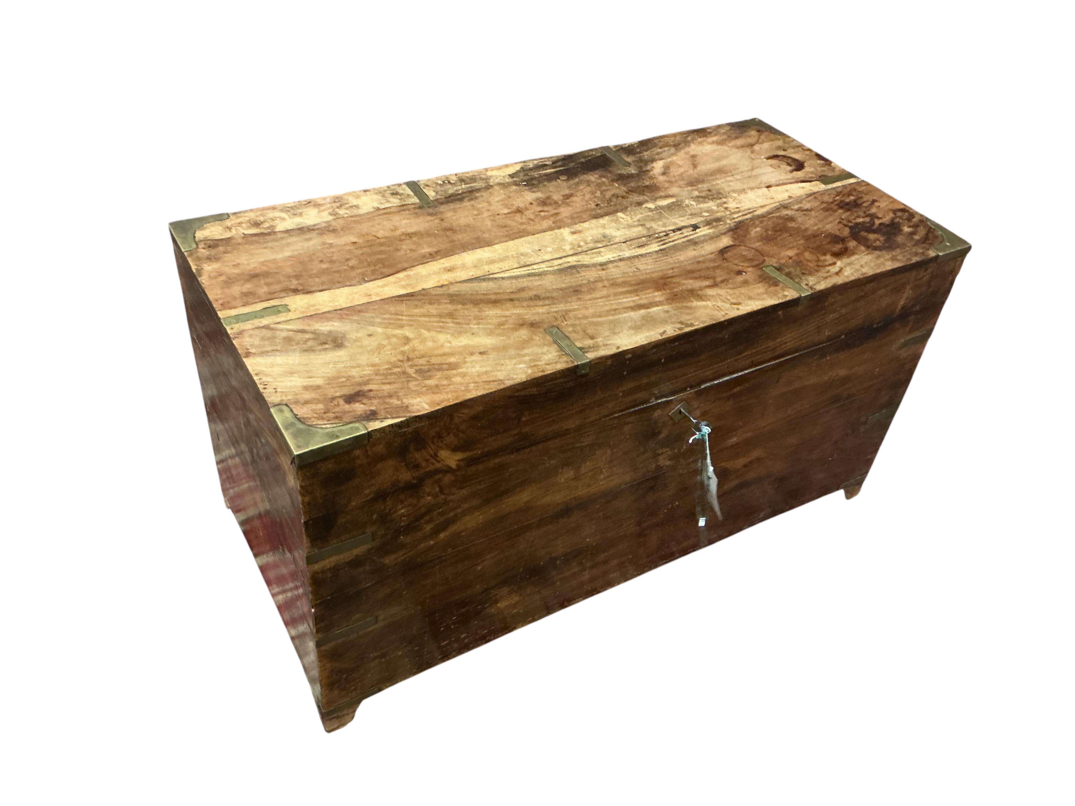 A late 19th century Anglo Indian brass bound hardwood trunk, width 86cm, depth 40cm, height 46cm